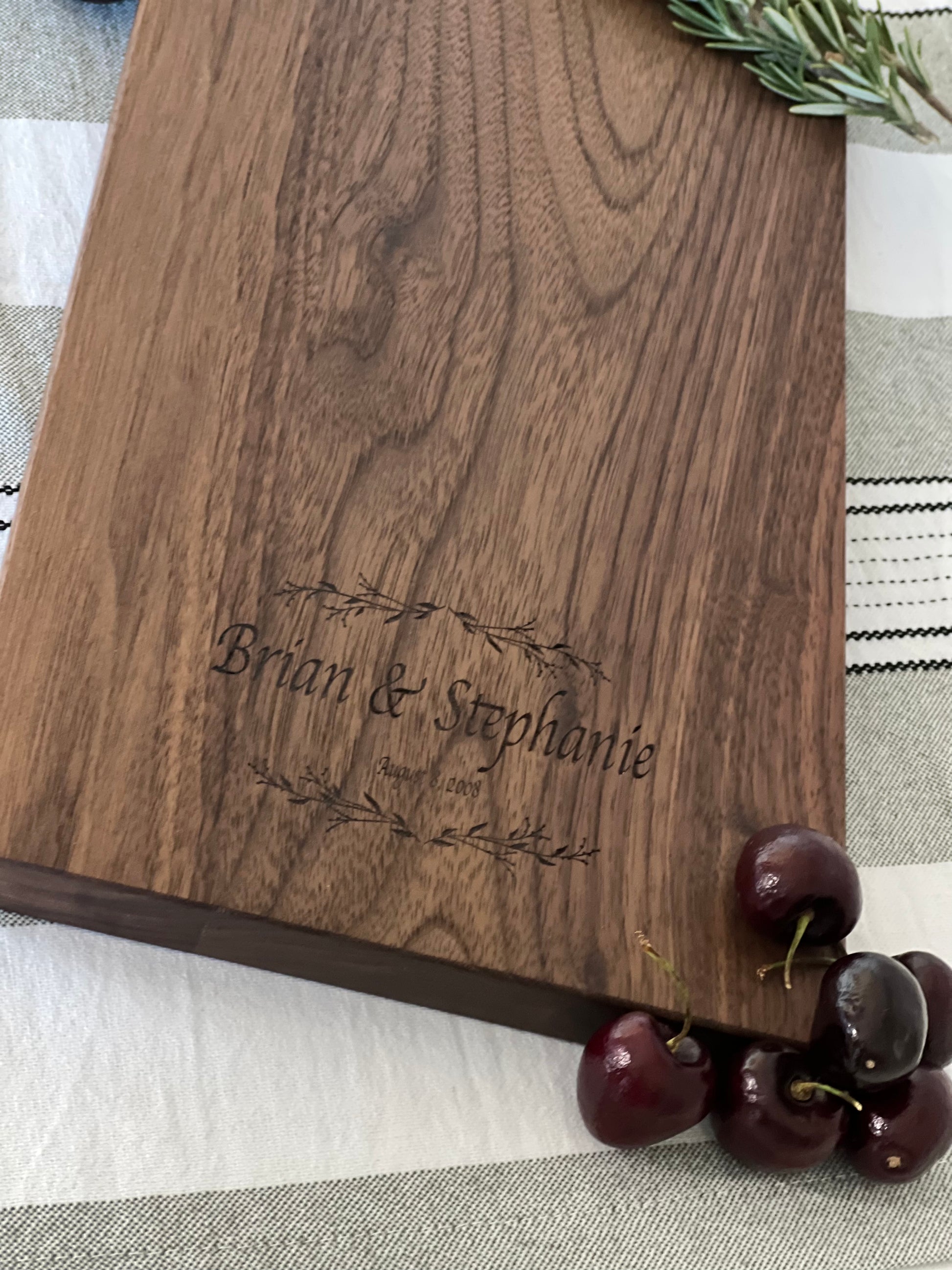 Close up on Couples Name and Anniversary Date on Walnut Charcuterie board